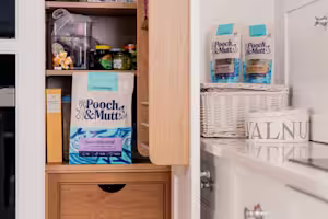 Pooch & Mutt food in a cupboard